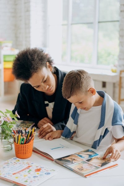 teacher with a young student