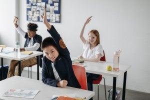 engaged students raising hands