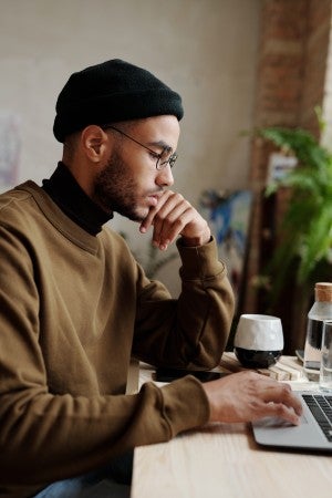 man studying online