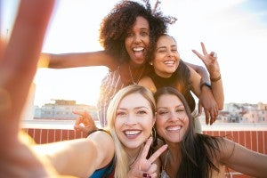 four women taking a selfie