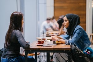 two teachers talking over coffee