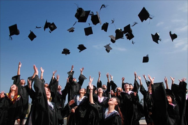 Group throwing graduation caps