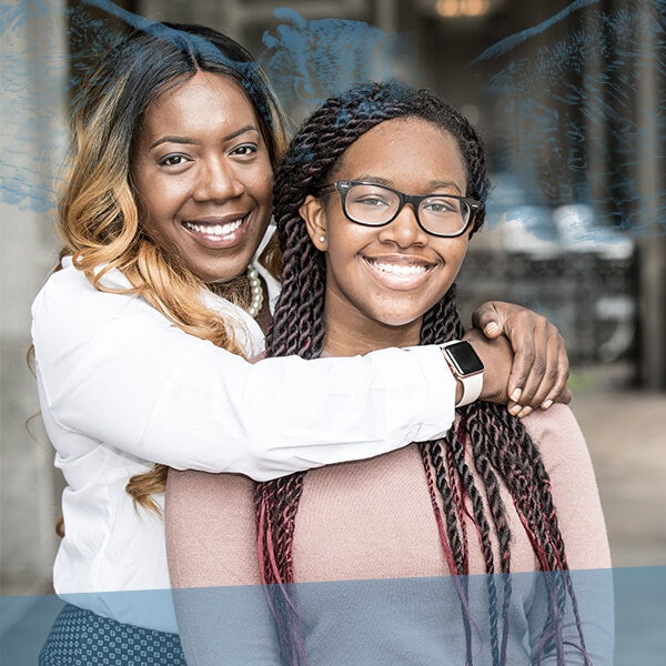 WGU alumna hugging her daughter
