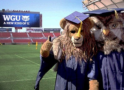 Sage the Owl mascot posing with another school's mascot