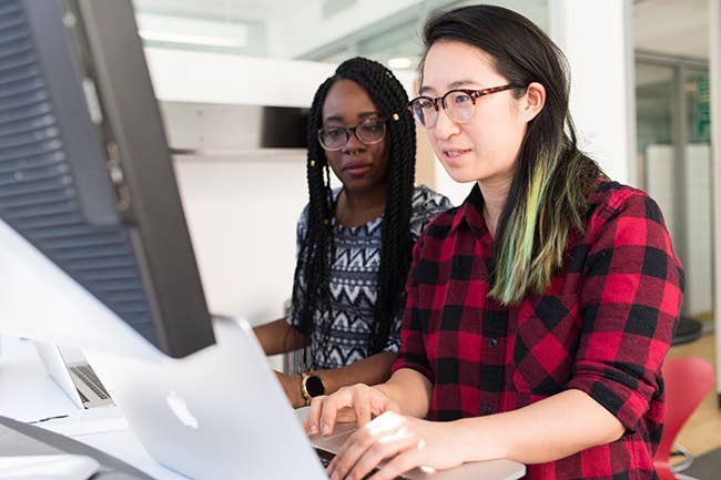 Multiethnic women working at computer