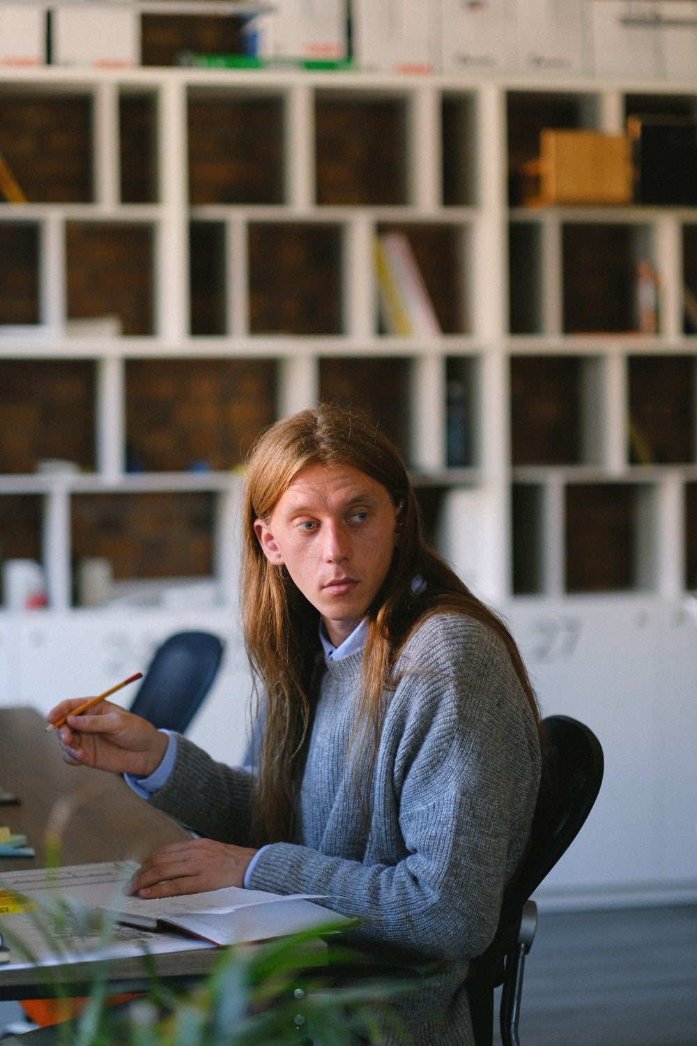 Man sitting at desk looking the other direction