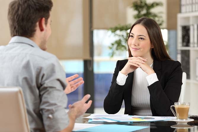 two people talking while meeting