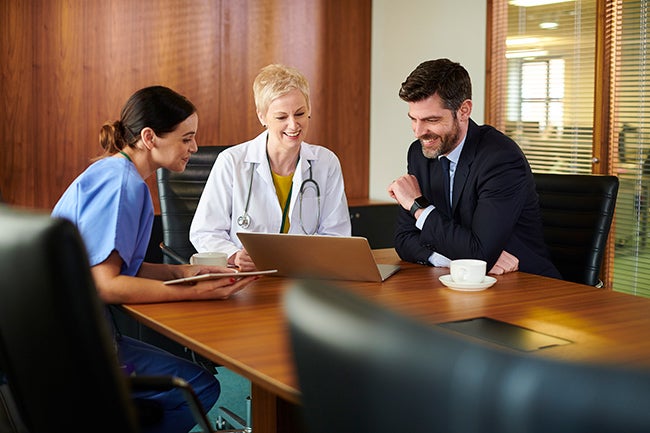 Healthcare professionals at a conference table