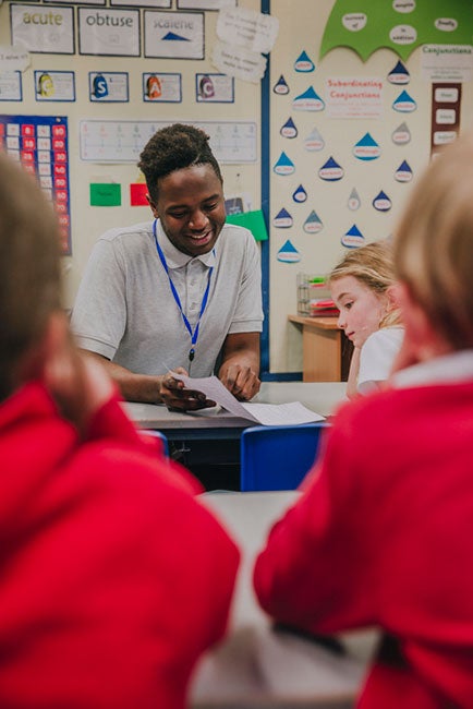 Elementary teacher working with students