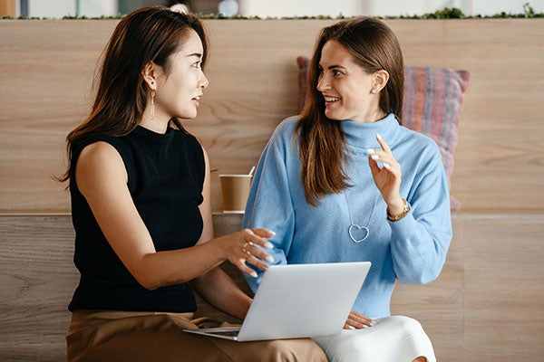 two business women talking 