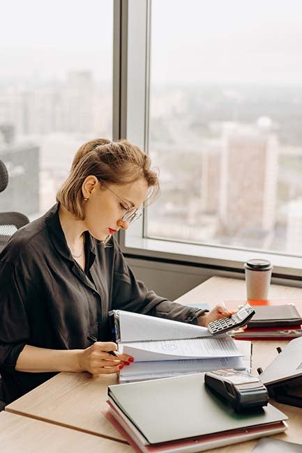 Women calculating and studying