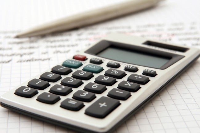 Calculator and pencil and paper