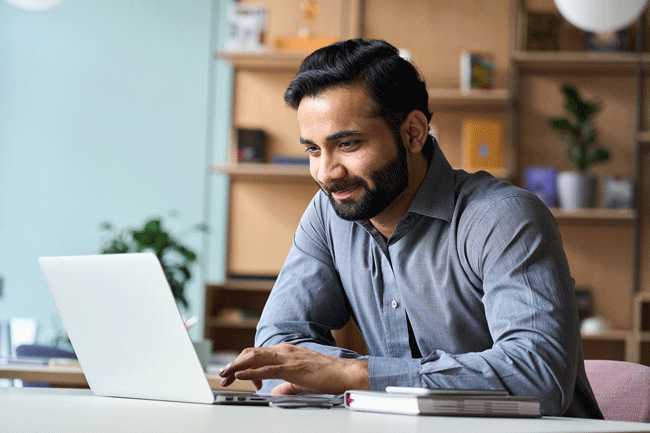 male working professional working on his laptop