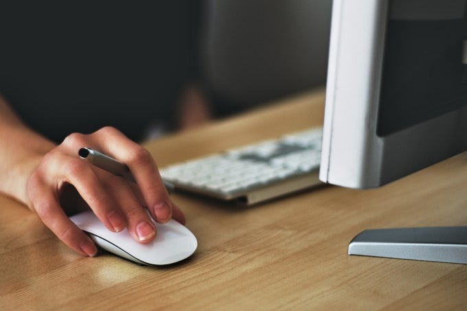 Hand on mouse computer