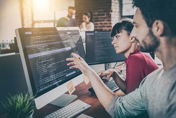 Developing programming and coding technologies. Website design. Programmer working in a software develop company office.; Shutterstock ID 699634498; PO: 123