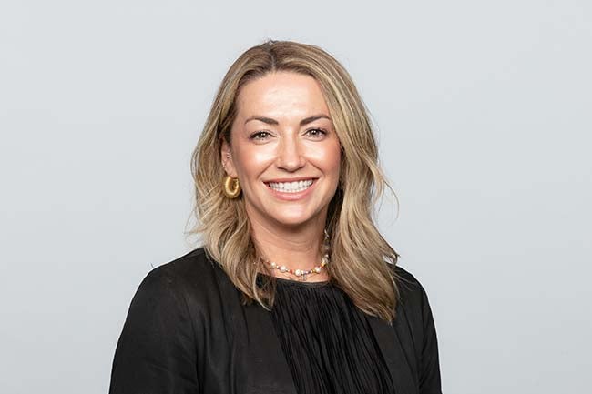 Women smiling about LA chargers