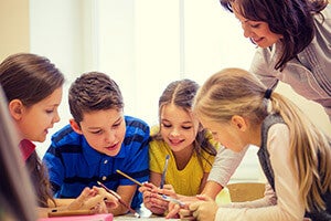 Elementary teacher and students