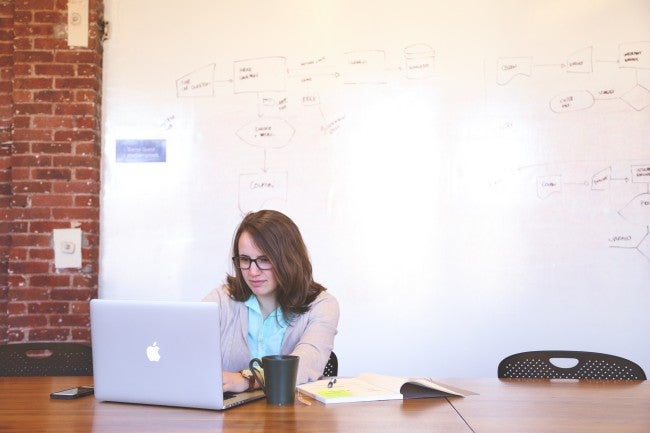 Online Education: Girl sitting alone at computer