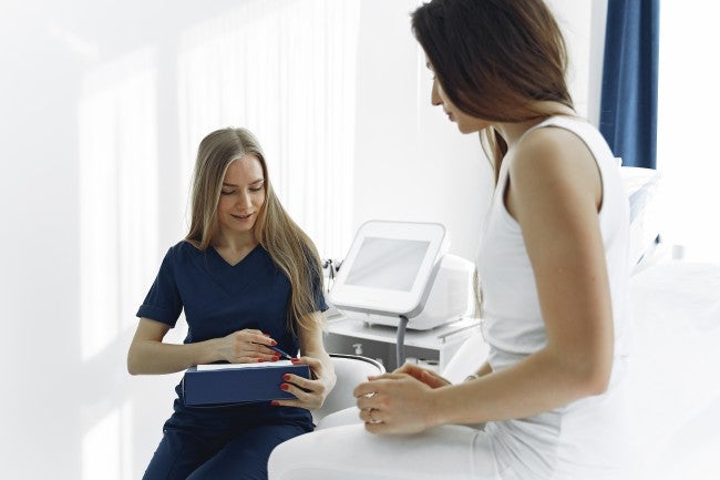 Nurse practitioner helping a patient