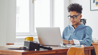 Student working on a laptop.