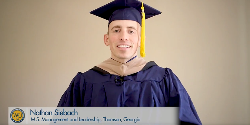 Nathan Siebach in graduation regalia