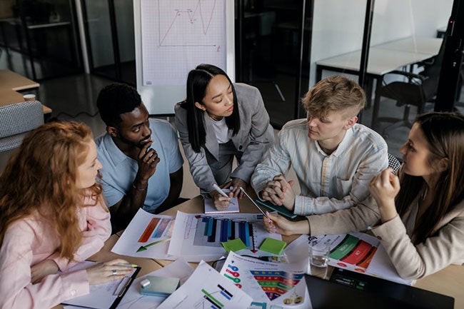 Group of people working otgether at a table